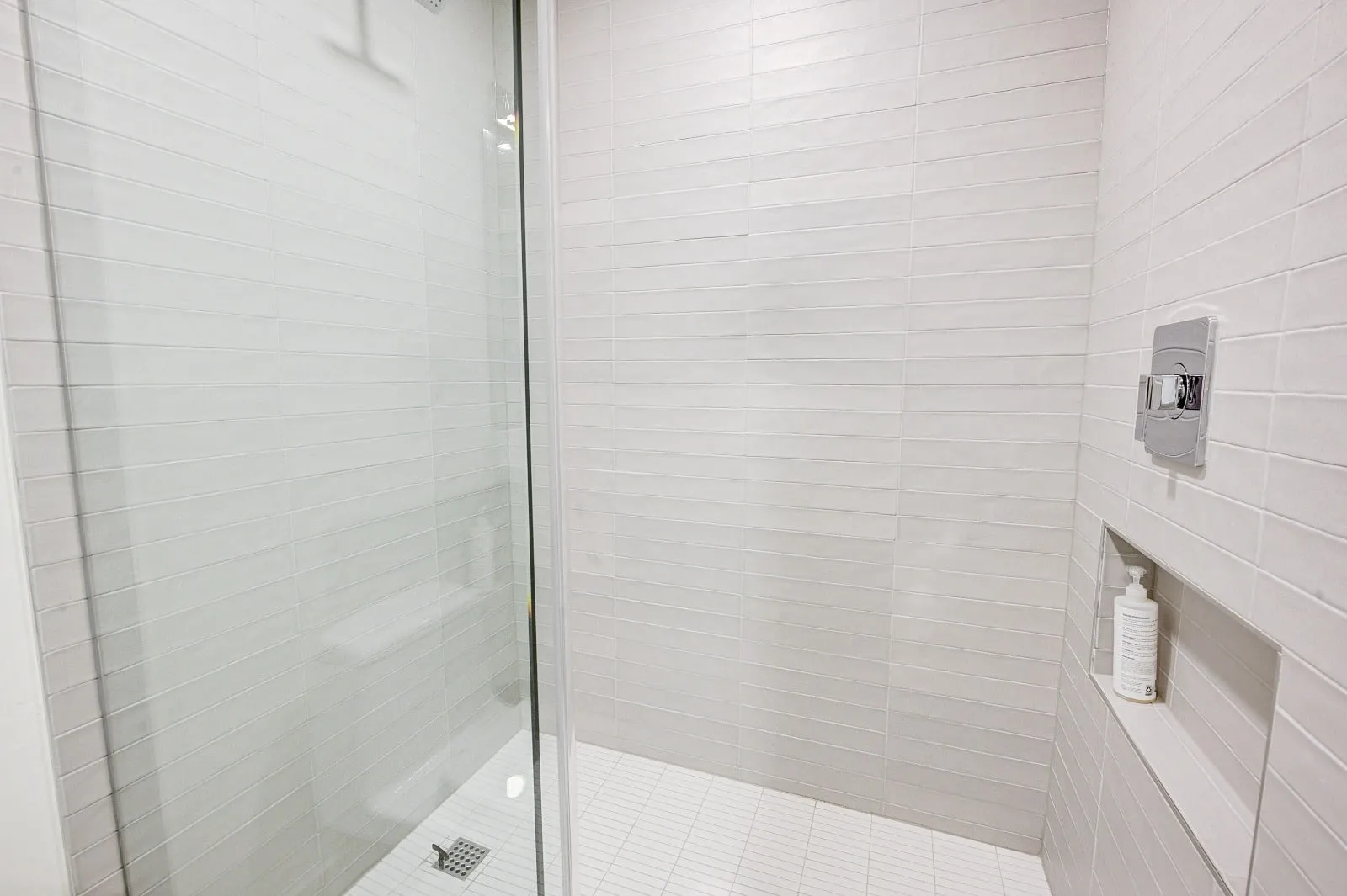 Marble bathroom with frameless glass and brushed nickel fittings in Carlton Woods, The Woodlands, TX