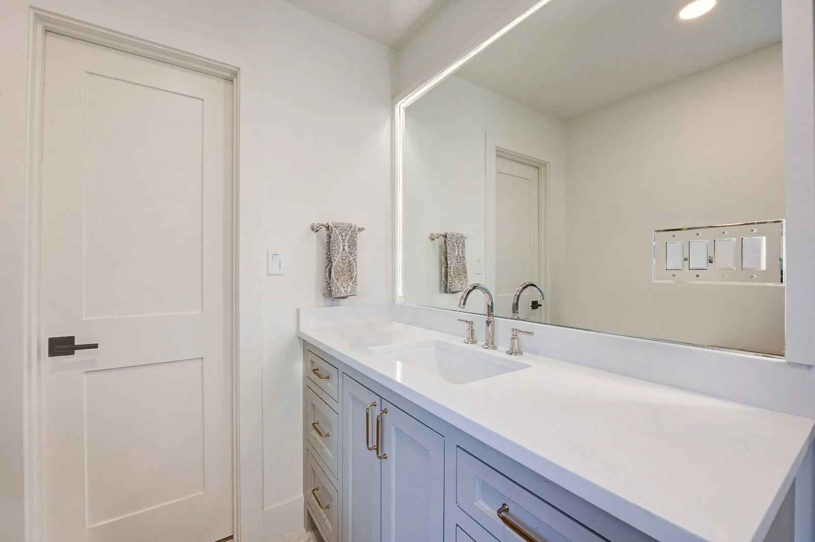 Marble bathroom with frameless glass and brushed nickel fittings in Carlton Woods, The Woodlands, TX