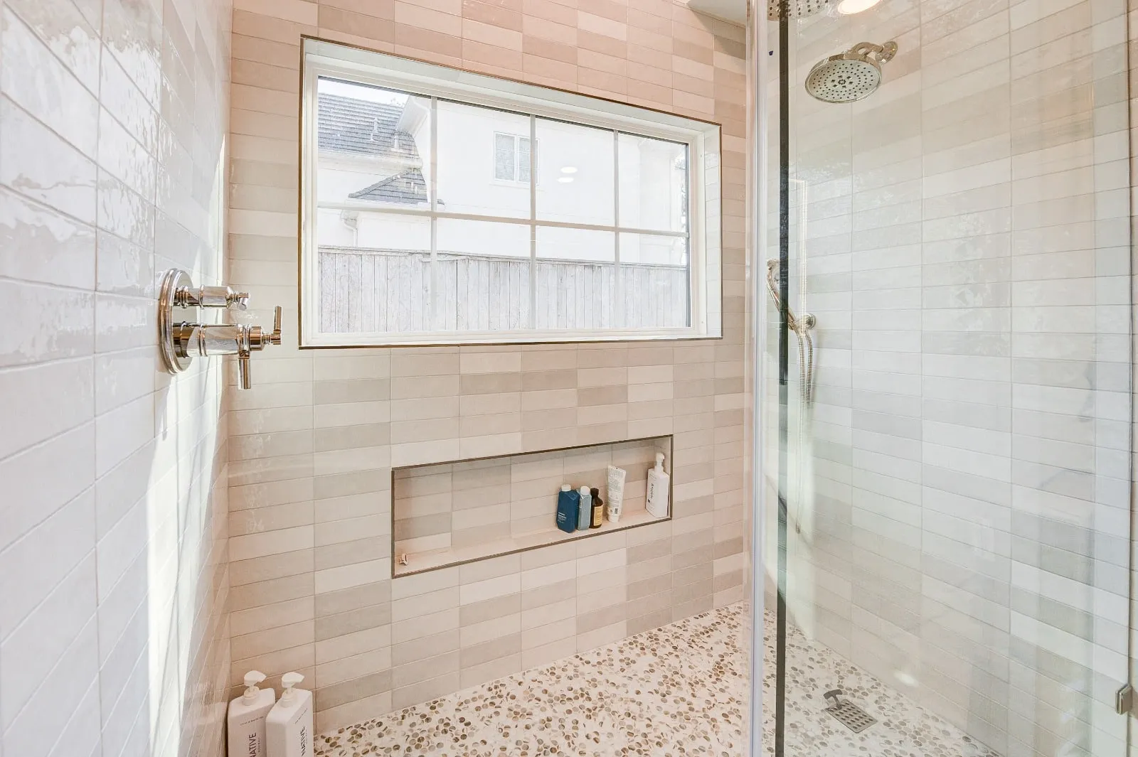 Marble bathroom with frameless glass and brushed nickel fittings in Carlton Woods, The Woodlands, TX