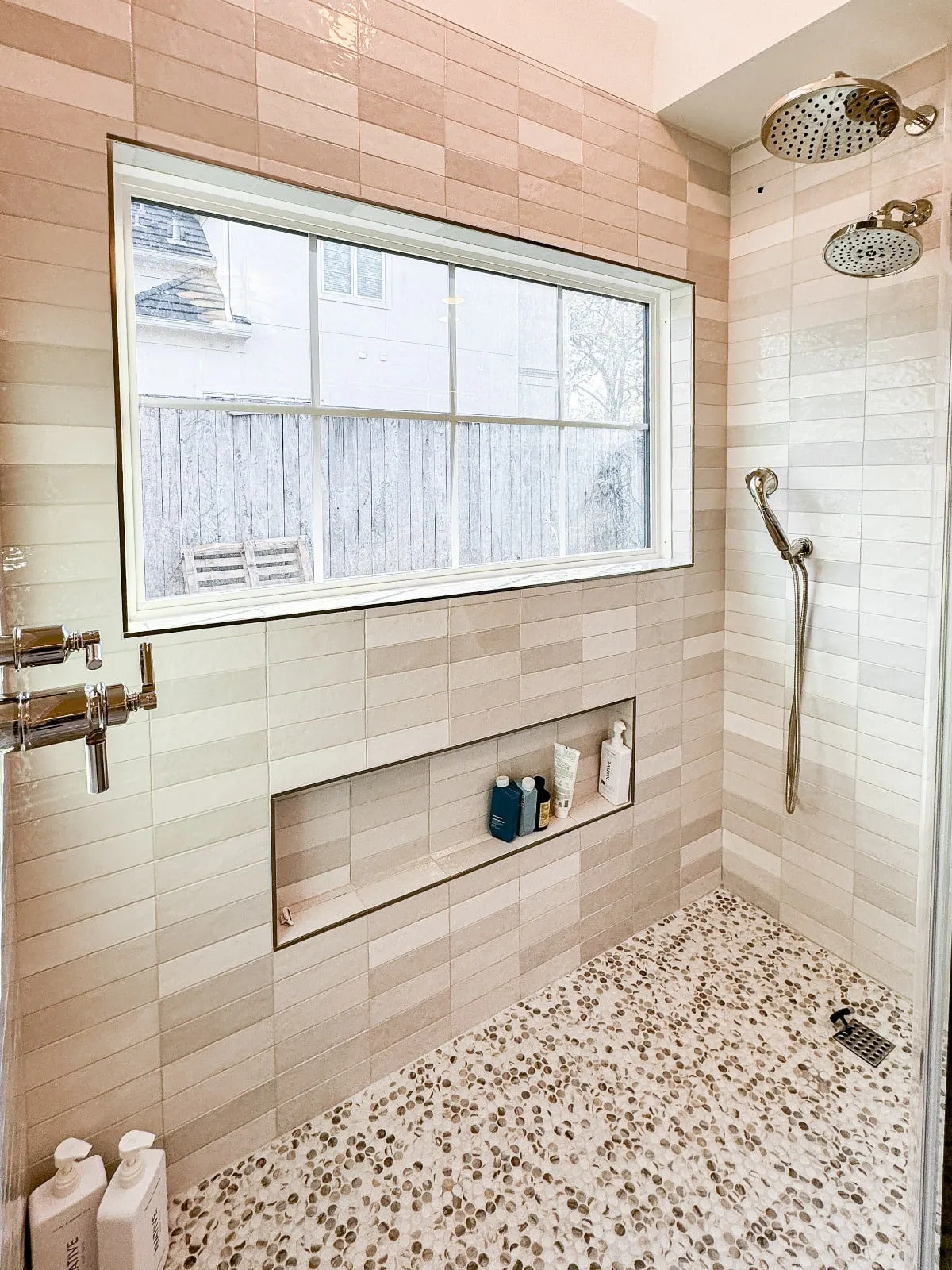 Marble bathroom with frameless glass and brushed nickel fittings in Carlton Woods, The Woodlands, TX