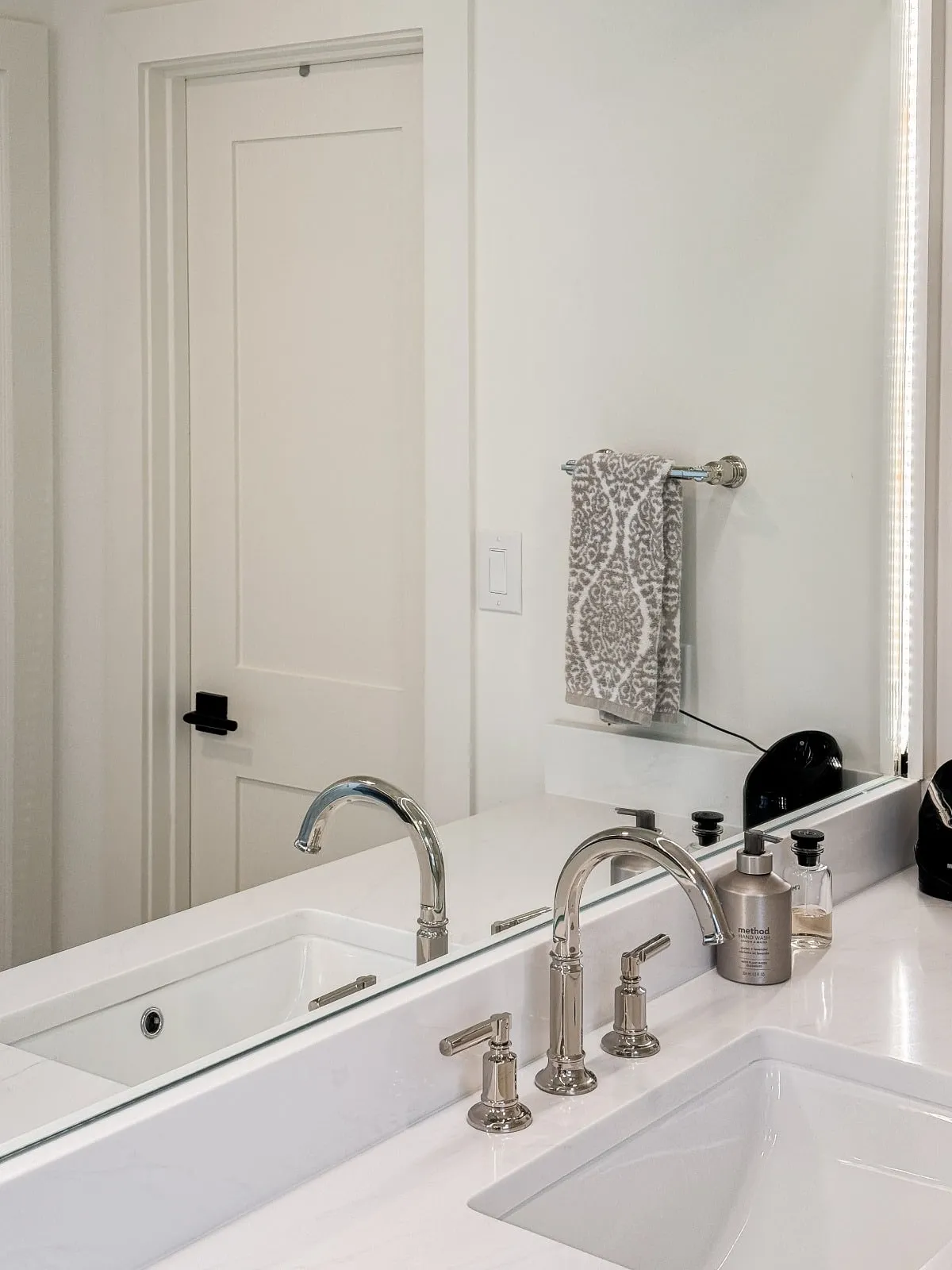 Marble bathroom with frameless glass and brushed nickel fittings in Carlton Woods, The Woodlands, TX