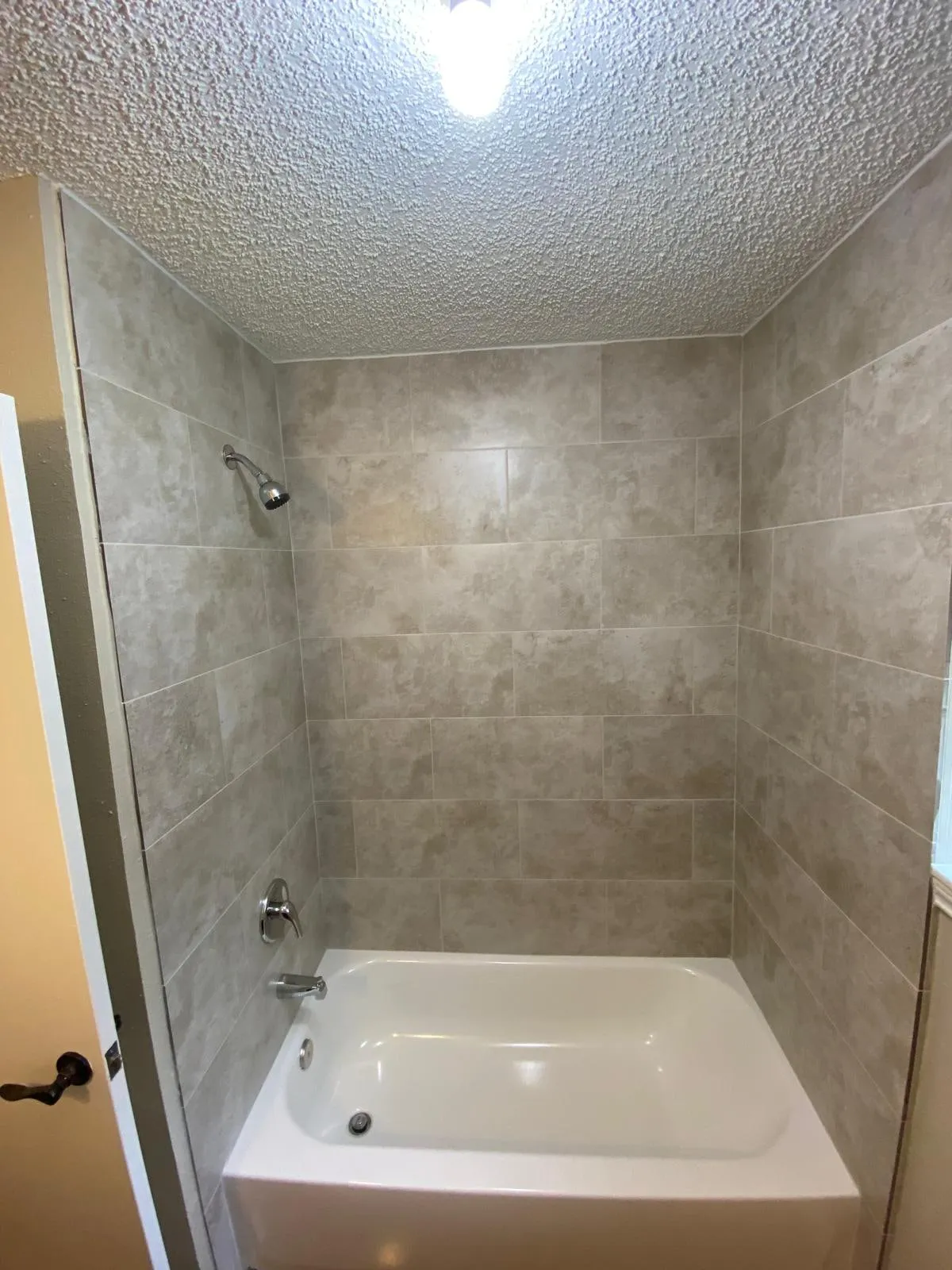 Bathroom remodel with a double vanity and a tiled walk-in shower in Cochran’s Crossing, The Woodlands, TX