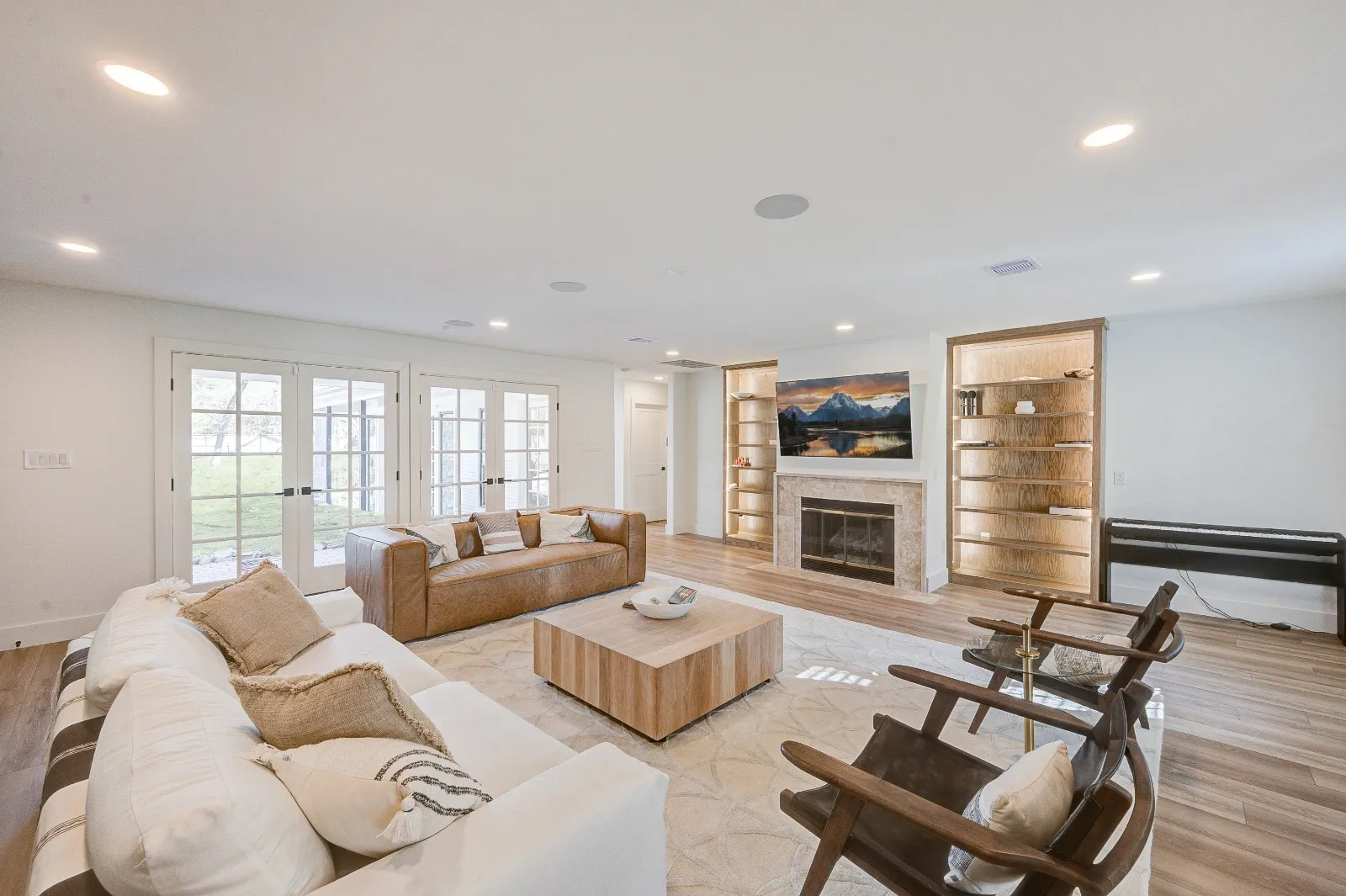 Living room with custom built-ins and fireplace in a whole-home renovation in The Woodlands, TX