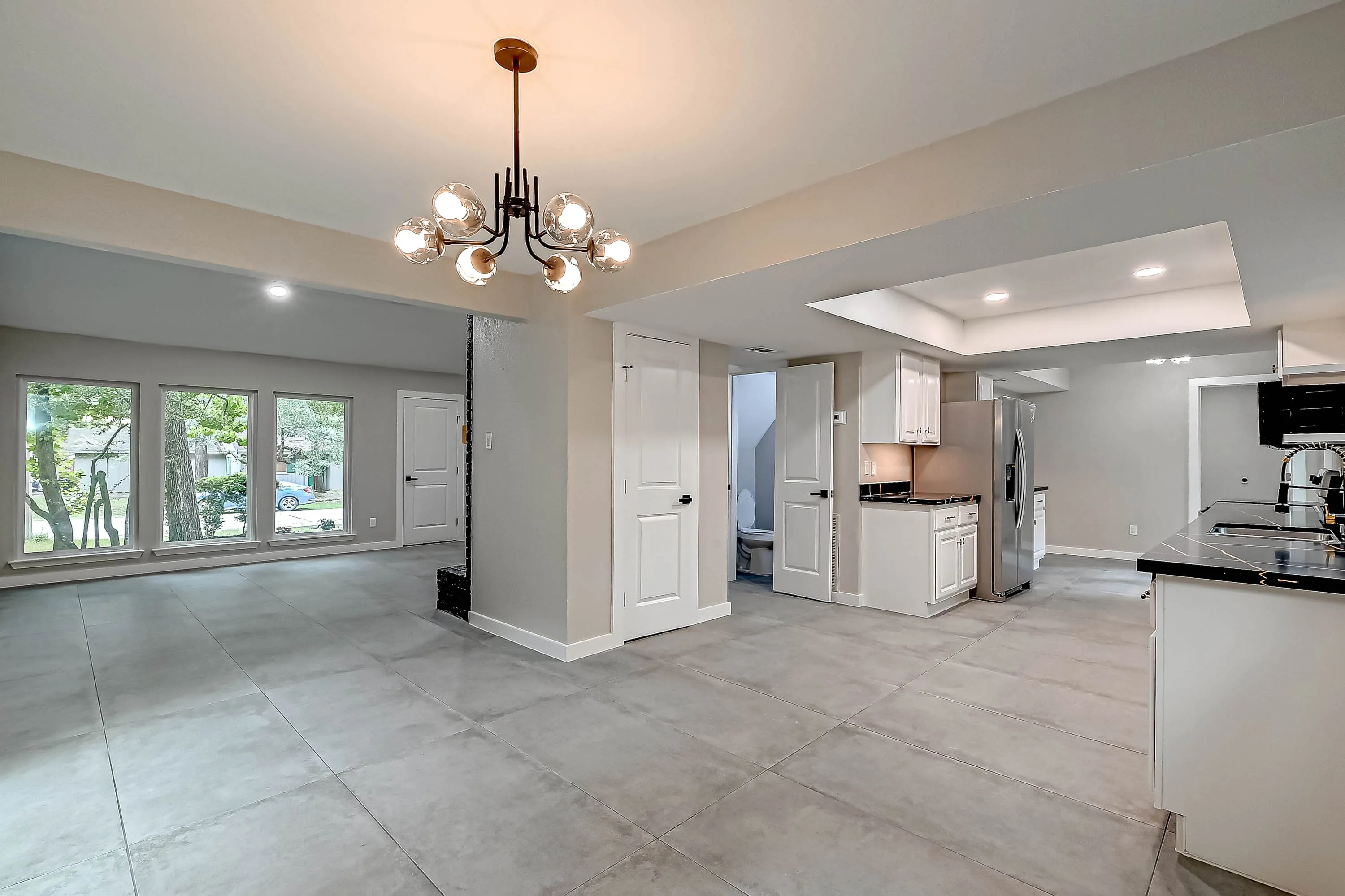 Whole home renovation of a mid-century house with a new kitchen and stair in The Woodlands, TX