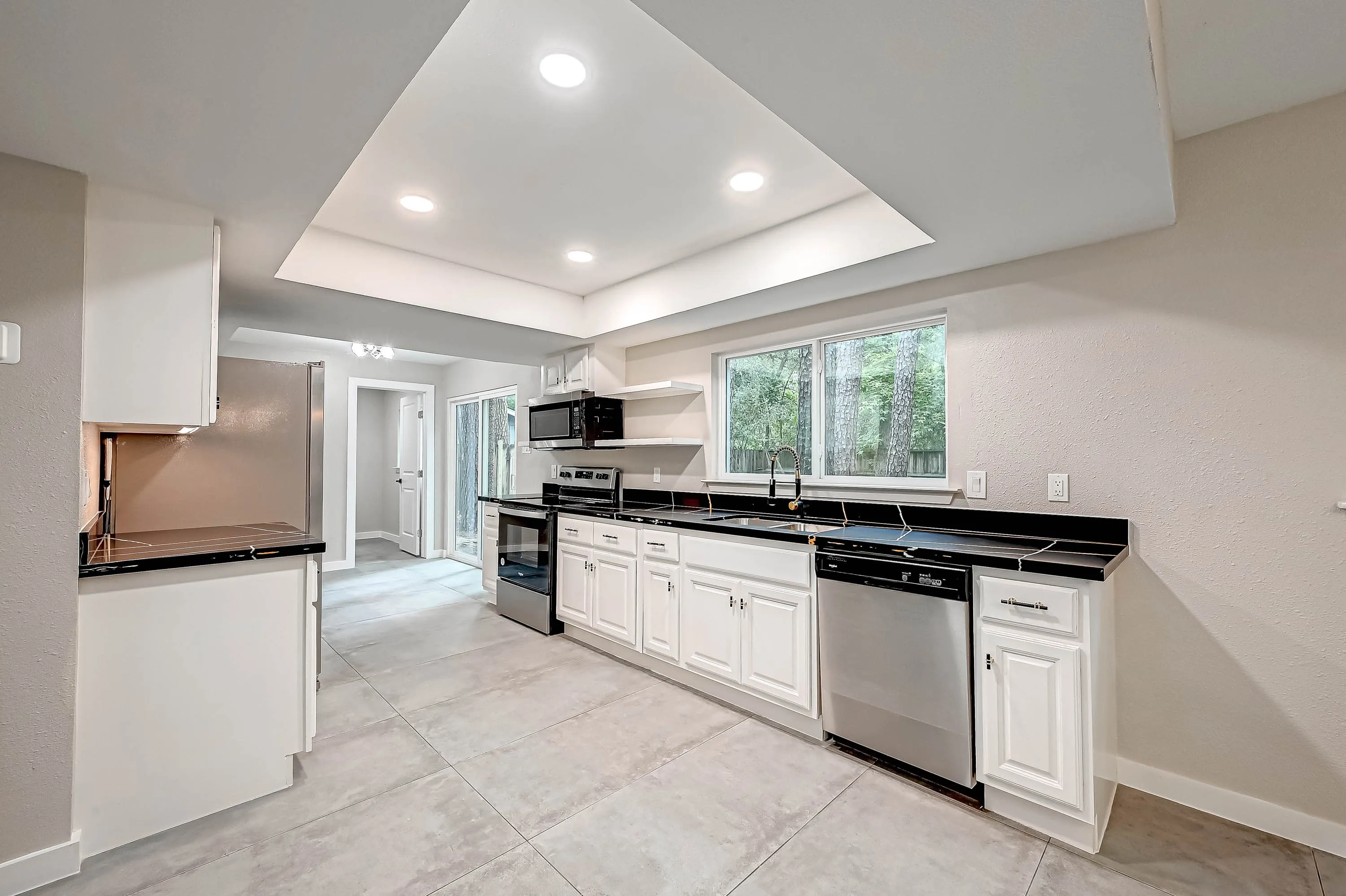 Whole home renovation of a mid-century house with a new kitchen and stair in The Woodlands, TX
