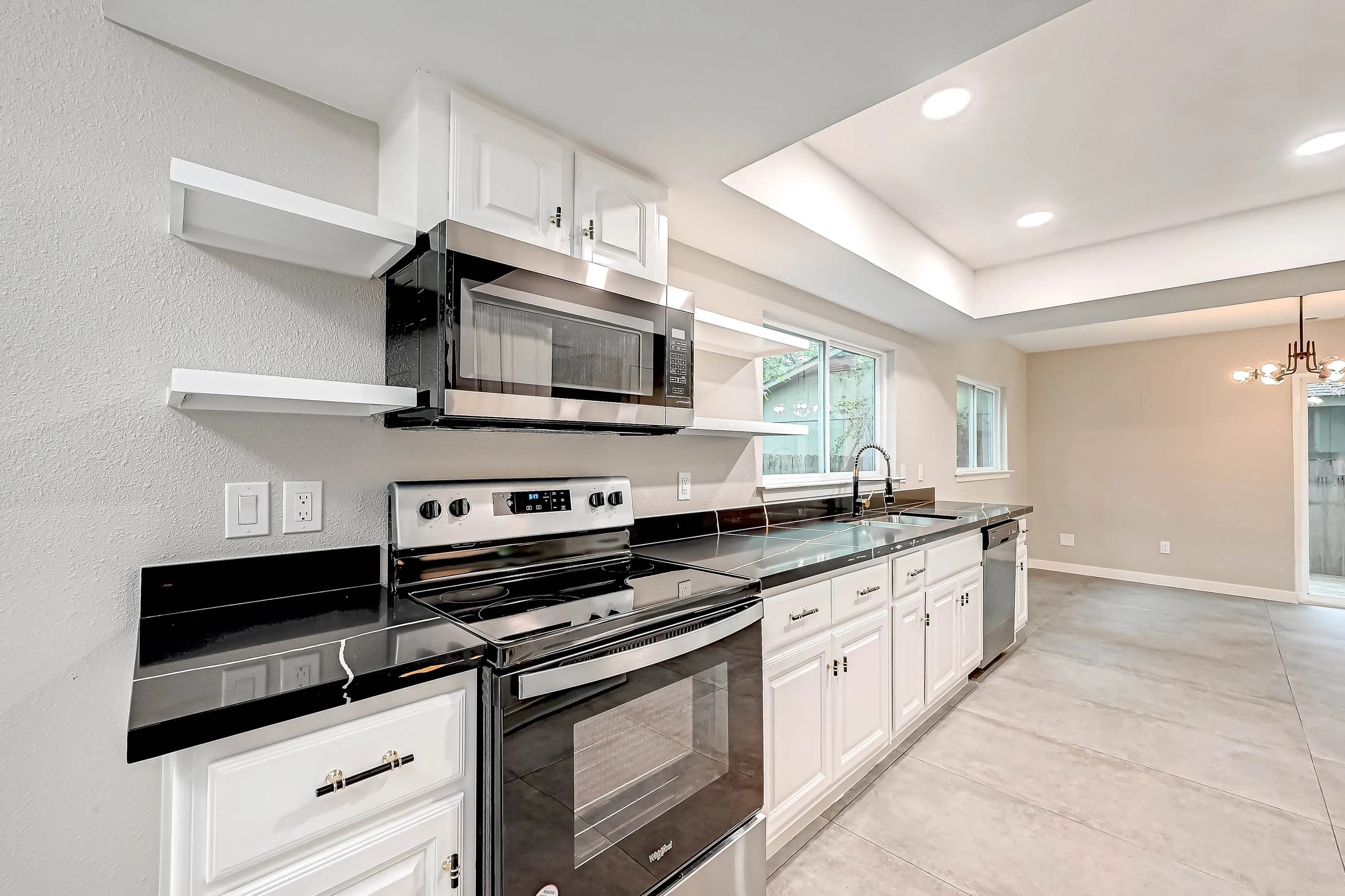 Whole home renovation of a mid-century house with a new kitchen and stair in The Woodlands, TX