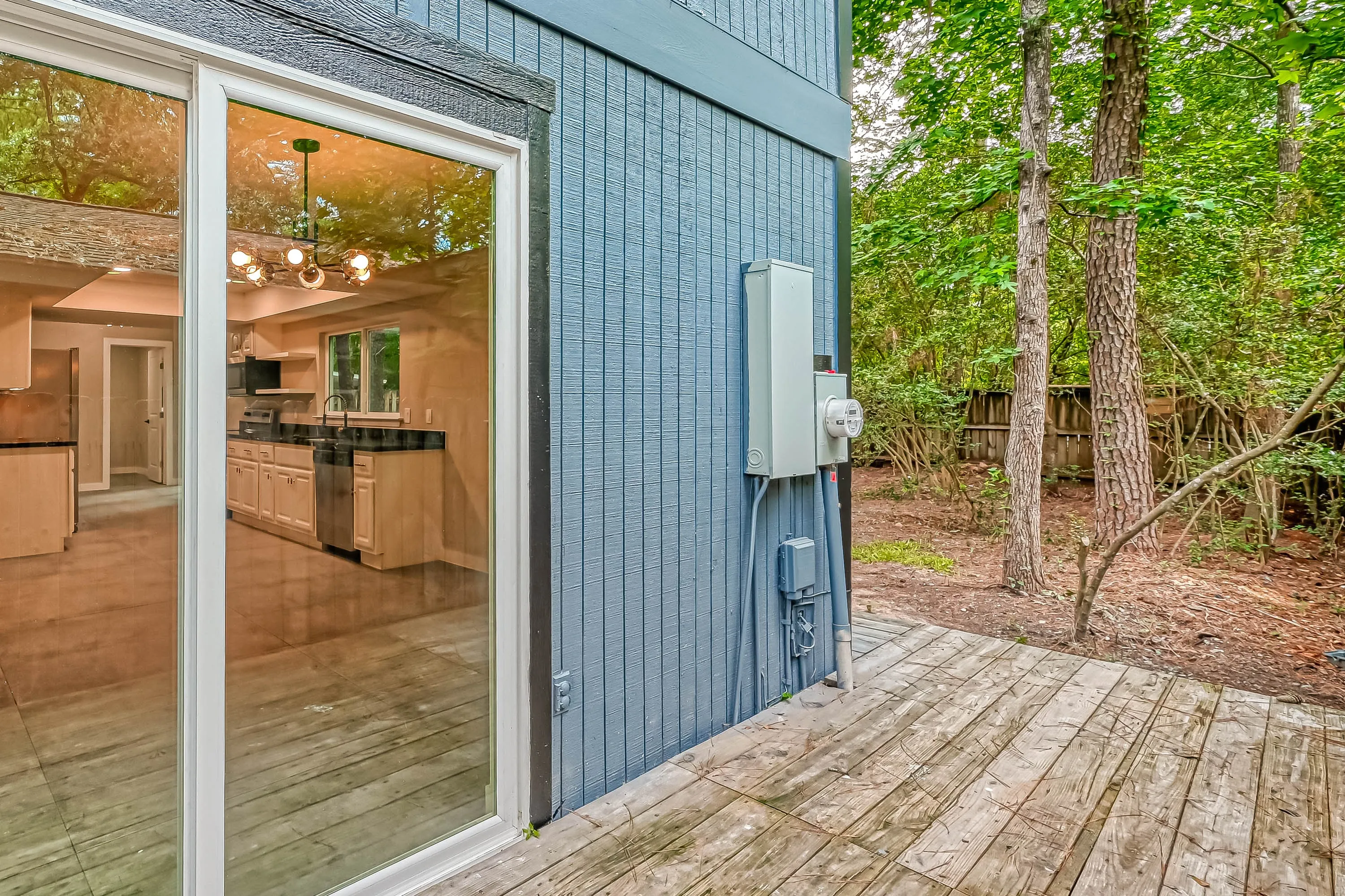 Whole home renovation of a mid-century house with a new kitchen and stair in The Woodlands, TX