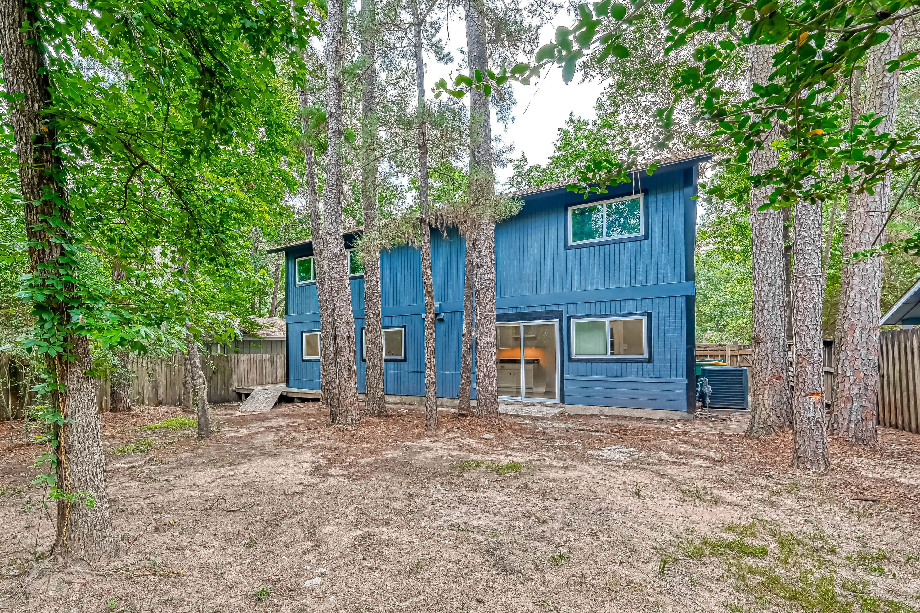 Whole home renovation of a mid-century house with a new kitchen and stair in The Woodlands, TX
