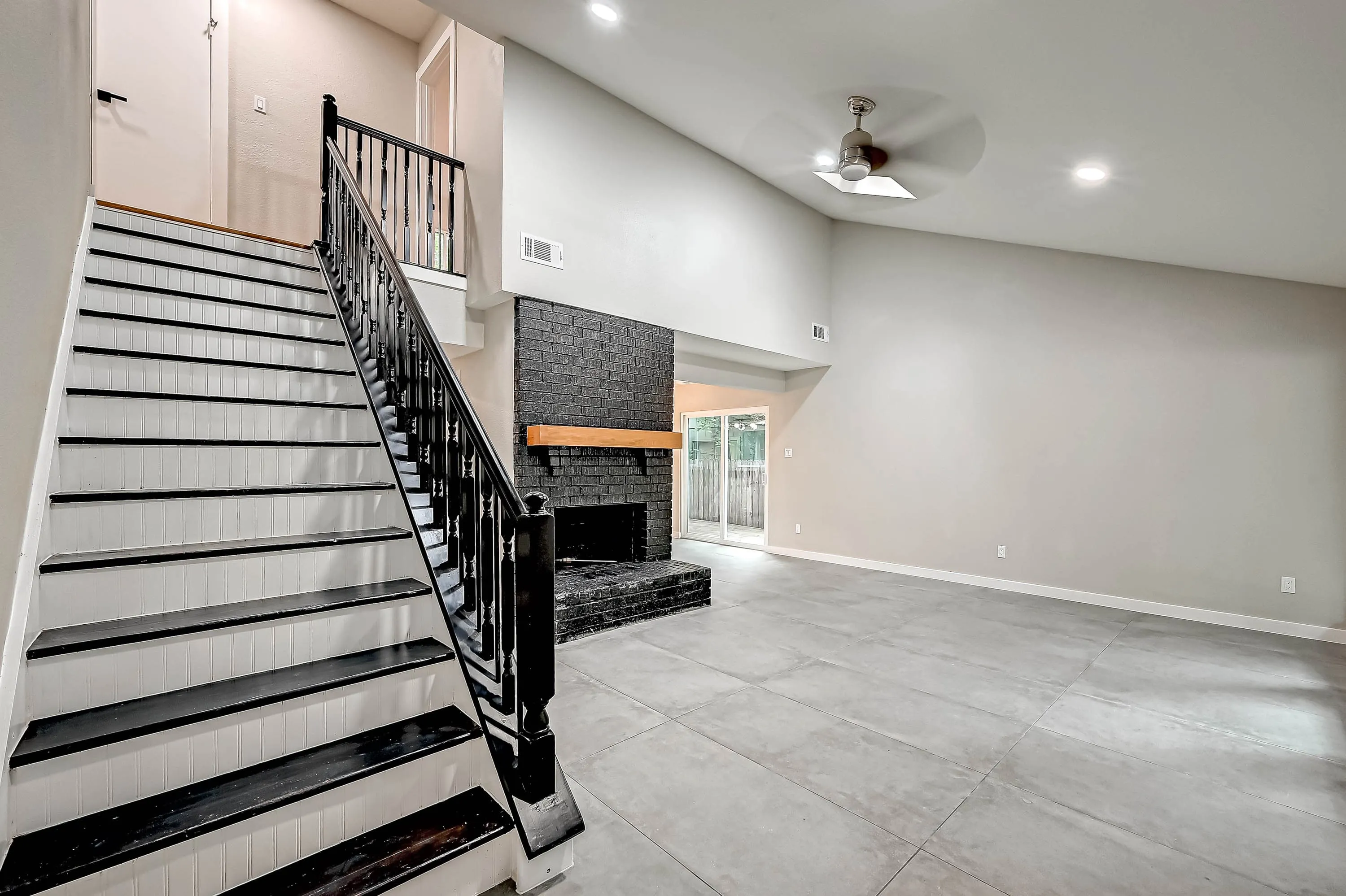 Whole home renovation of a mid-century house with a new kitchen and stair in The Woodlands, TX