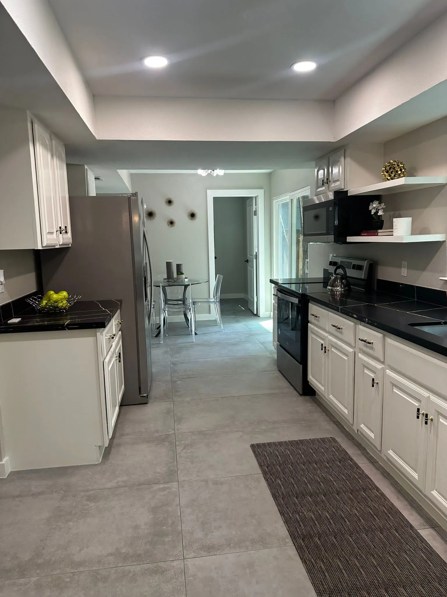 Whole home renovation of a mid-century house with a new kitchen and stair in The Woodlands, TX