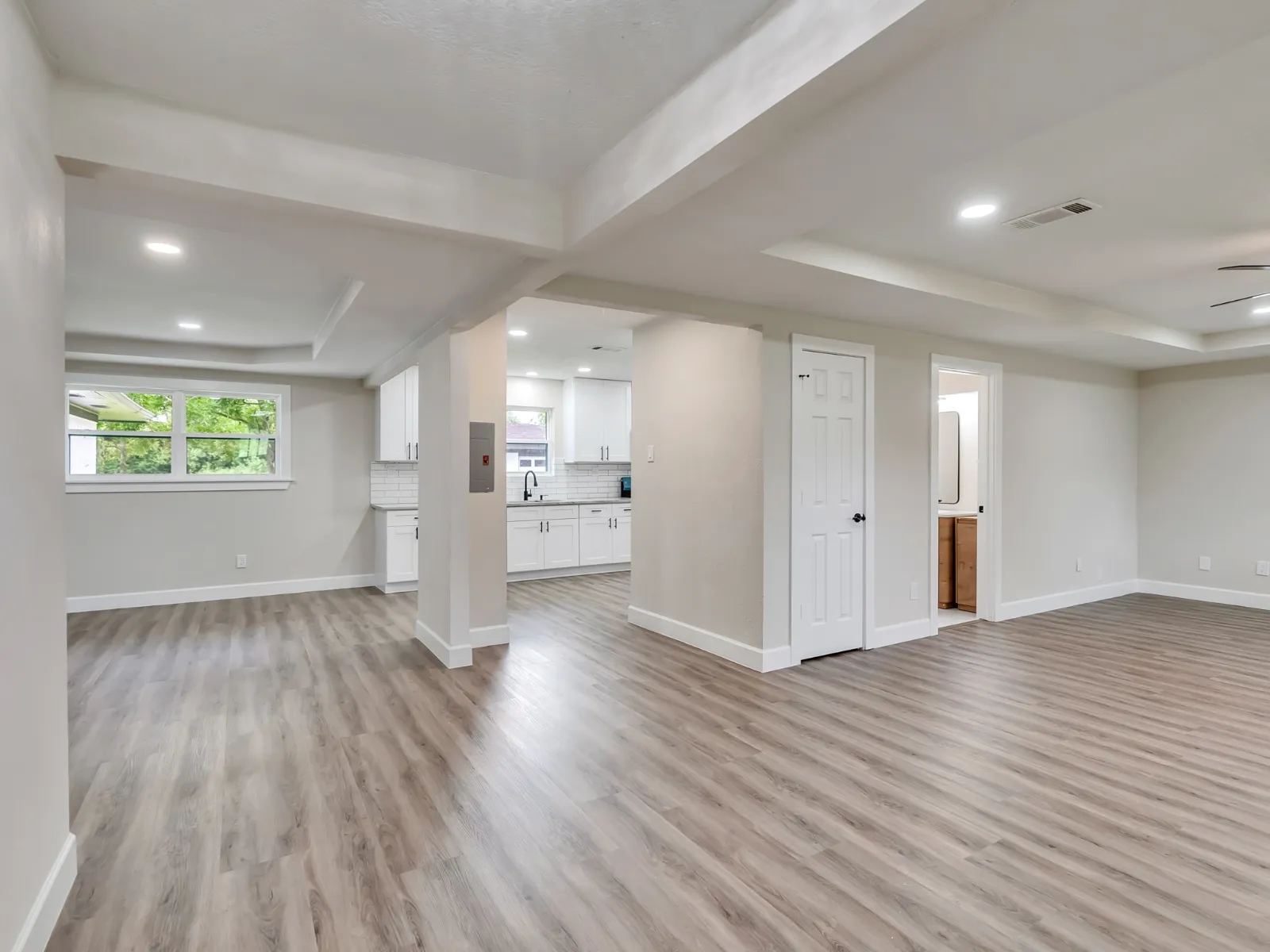 Open floor plan after a whole home renovation, with new flooring carried through in The Woodlands, TX