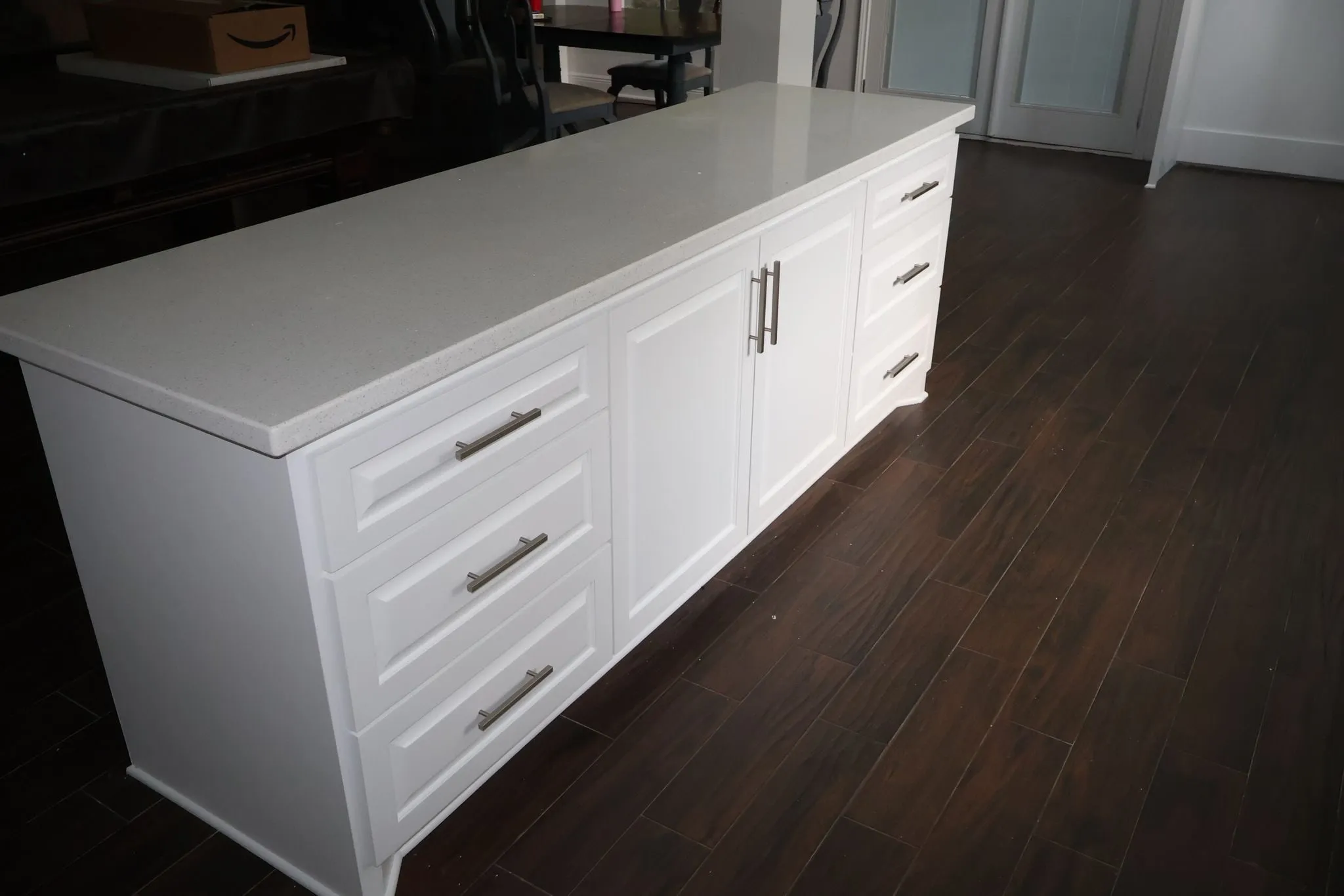 White shaker kitchen remodel with a herringbone backsplash in Panther Creek, The Woodlands, TX