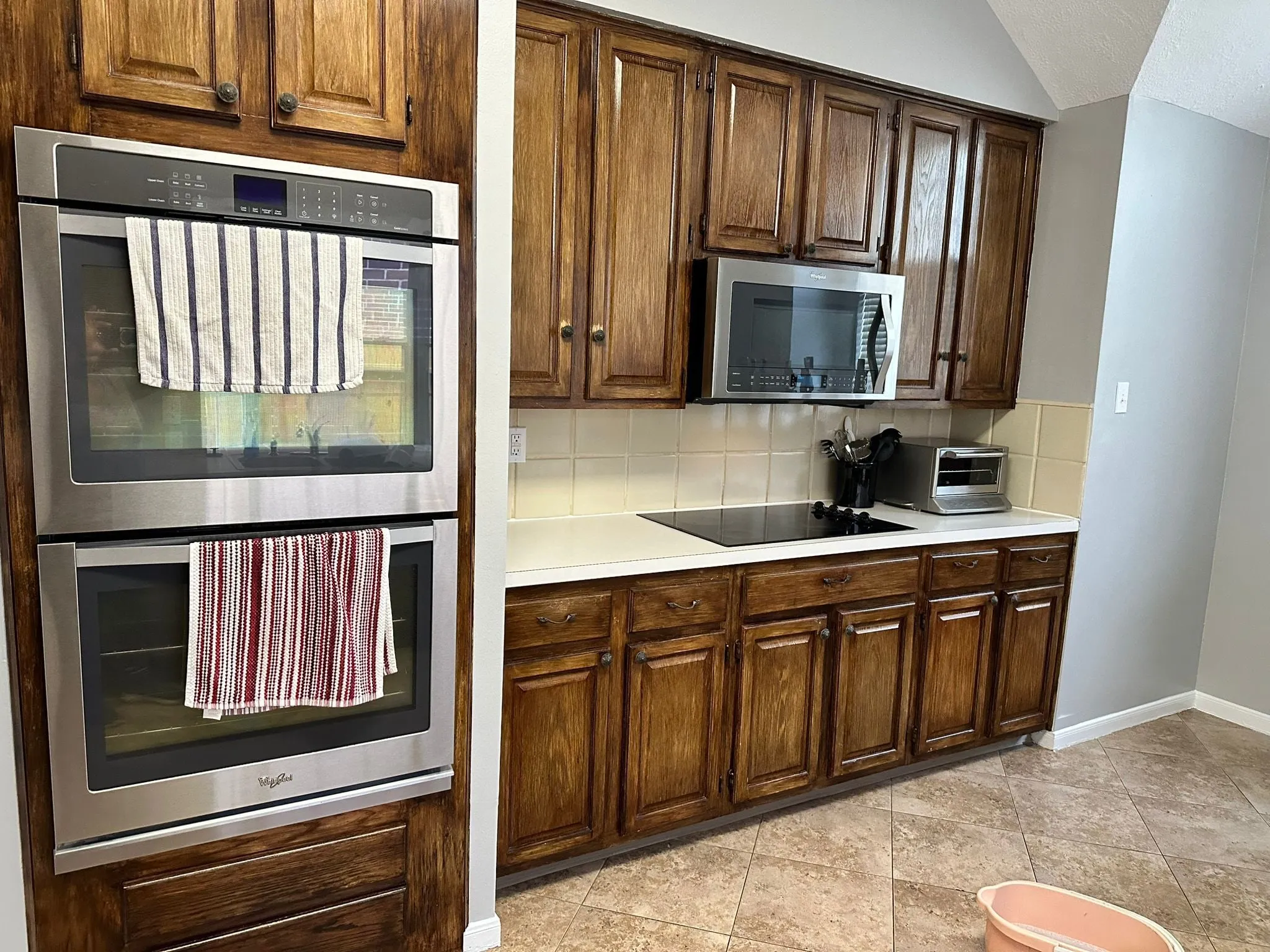 Whole home renovation with new plank flooring and arched windows in Panther Creek, The Woodlands, TX