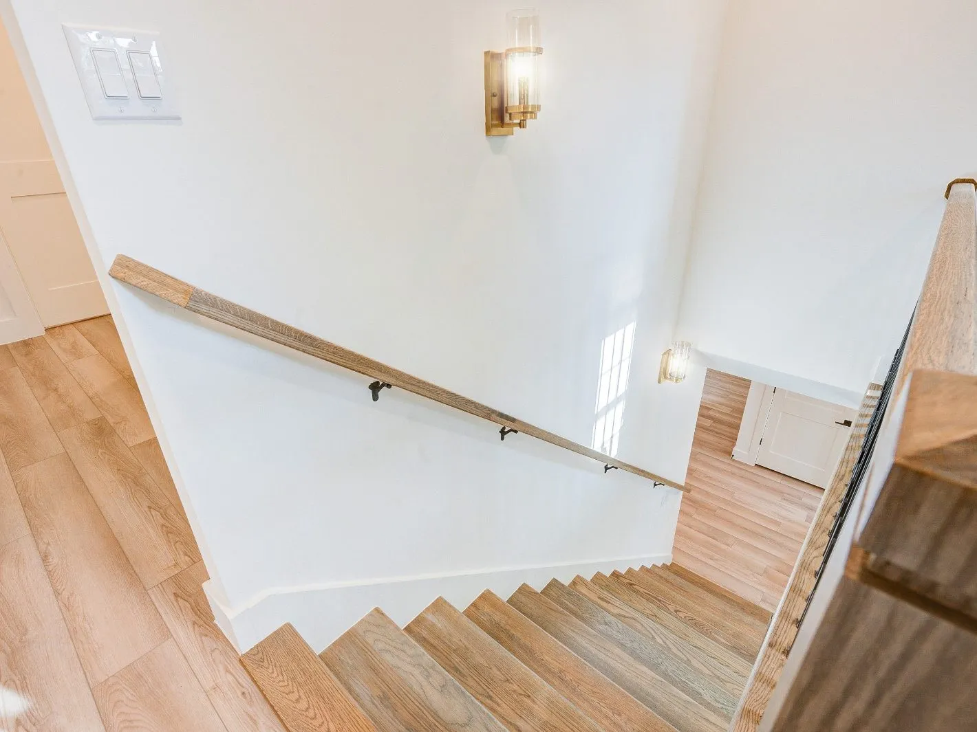 White oak stair and handrail detail from a home renovation in The Woodlands, TX